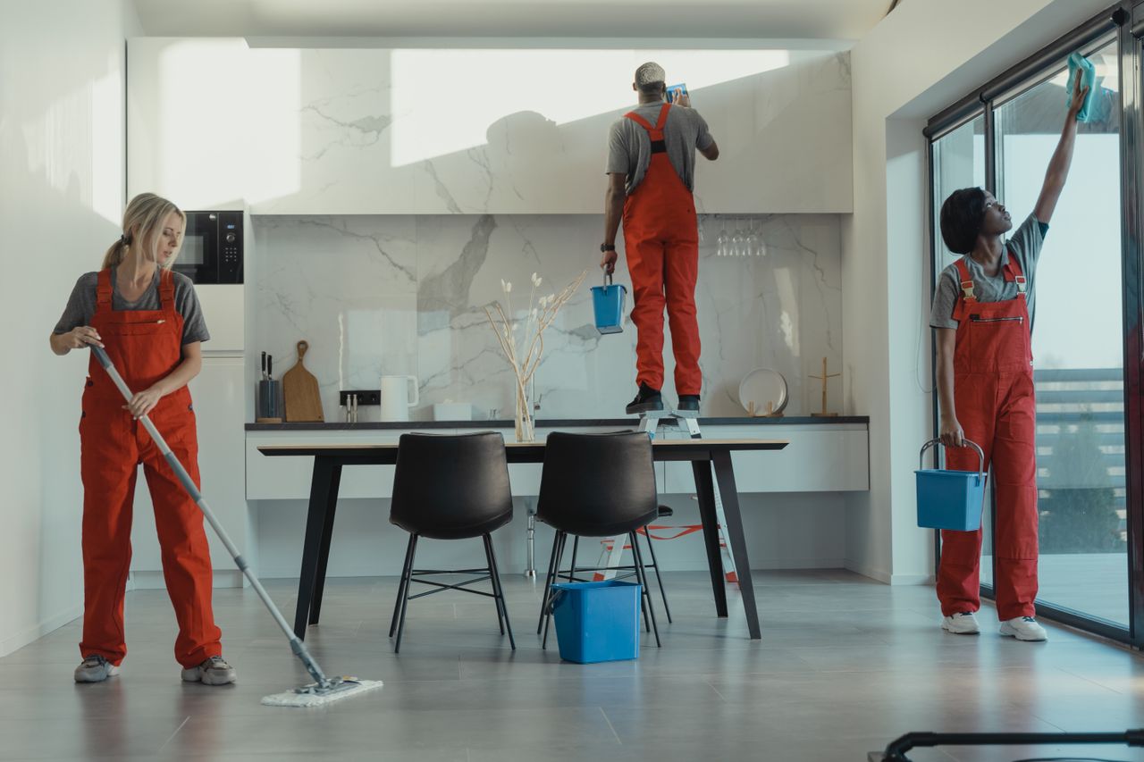Professional cleaner preparing a business premises for inspection