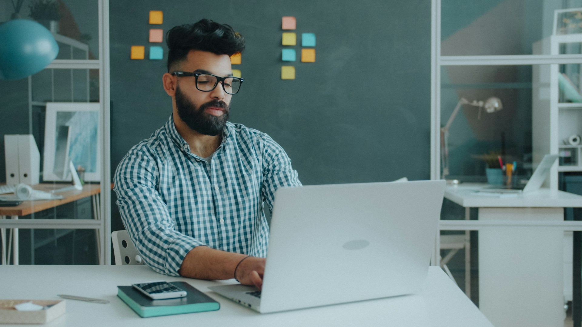 IT professional accessing business documents through integrated ERP software